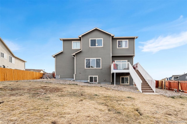 back of property featuring a deck