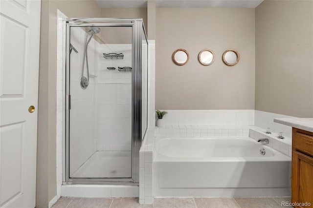 bathroom with tile patterned flooring, vanity, and independent shower and bath