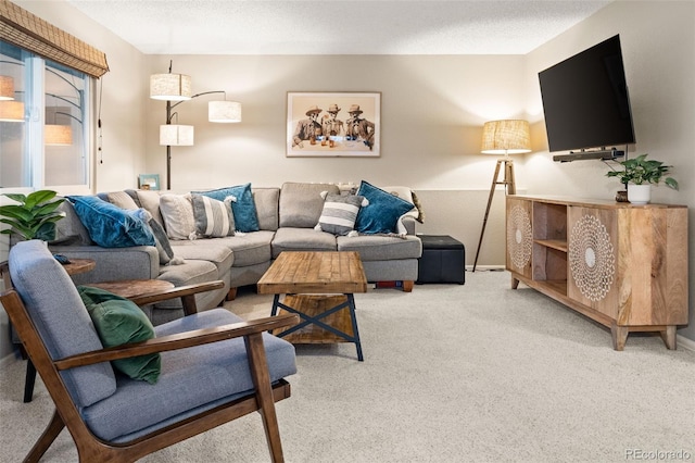 living room featuring light carpet and a textured ceiling