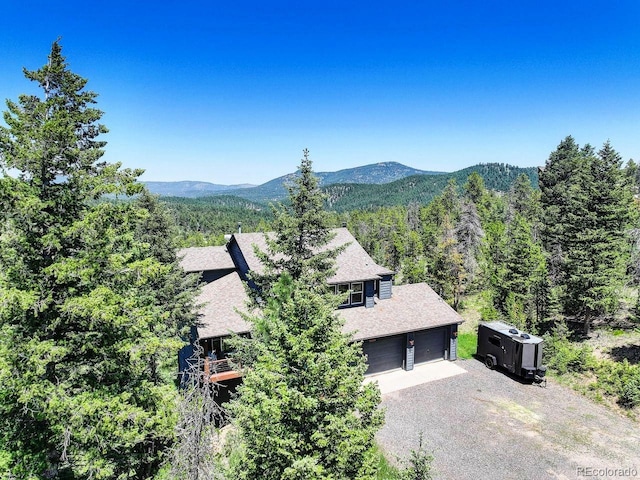 30889 Manitoba Dr, Evergreen, CO 80439 - view of mountain background featuring a forest