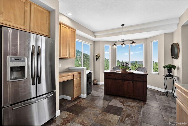 30889 Manitoba Dr, Evergreen, CO 80439 - kitchen with stainless steel refrigerator with ice dispenser, plenty of natural light, stone tile flooring, wine cooler, and recessed lighting
