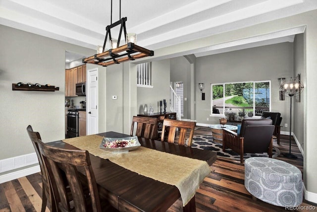 30889 Manitoba Dr, Evergreen, CO 80439 - dining room featuring dark wood-type flooring, stairs, and a chandelier