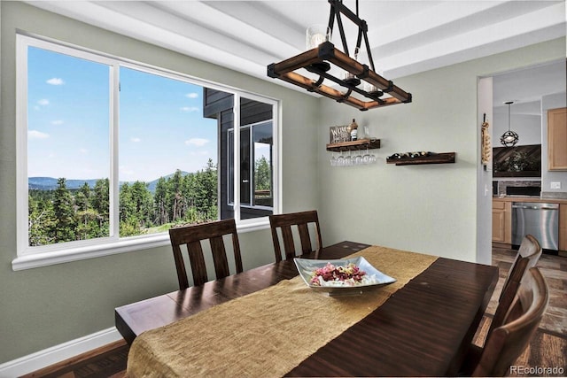 30889 Manitoba Dr, Evergreen, CO 80439 - dining area with healthy amount of natural light and dark wood finished floors