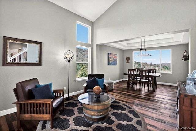 30889 Manitoba Dr, Evergreen, CO 80439 - living room with dark wood-style floors, a chandelier, and lofted ceiling