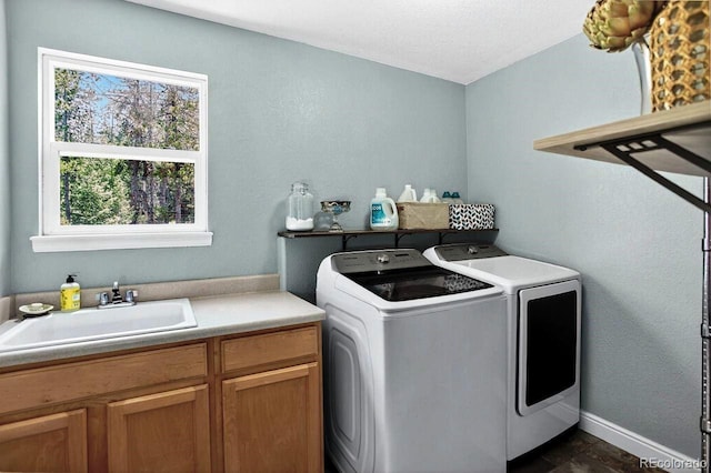 30889 Manitoba Dr, Evergreen, CO 80439 - laundry area with cabinet space, washer and clothes dryer, and a textured ceiling