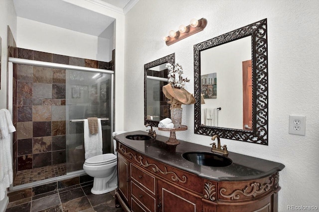 30889 Manitoba Dr, Evergreen, CO 80439 - bathroom featuring double vanity, ornamental molding, a shower stall, and a textured wall