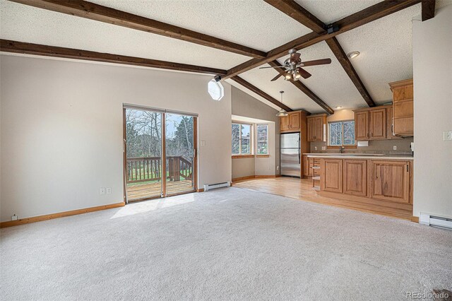 70 Silver Springs Rd, Bailey, CO 80421 - unfurnished living room featuring a baseboard heating unit, light carpet, ceiling fan, baseboards, and a textured ceiling