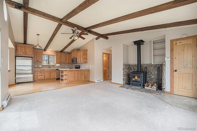 70 Silver Springs Rd, Bailey, CO 80421 - kitchen with stainless steel appliances, light colored carpet, open floor plan, a baseboard radiator, and light countertops