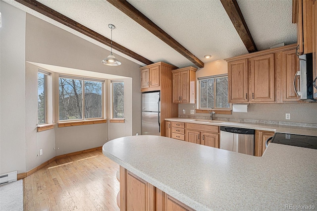 70 Silver Springs Rd, Bailey, CO 80421 - kitchen featuring stainless steel appliances, a textured ceiling, baseboards, a peninsula, and light countertops