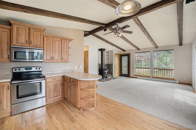 70 Silver Springs Rd, Bailey, CO 80421 - kitchen with stainless steel appliances, open shelves, open floor plan, a peninsula, and a baseboard radiator
