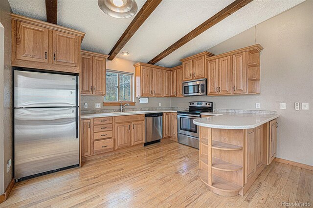 70 Silver Springs Rd, Bailey, CO 80421 - kitchen featuring open shelves, stainless steel appliances, a sink, light countertops, and a textured ceiling