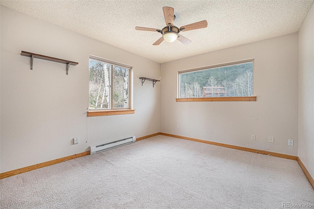 70 Silver Springs Rd, Bailey, CO 80421 - spare room featuring a baseboard radiator, carpet floors, ceiling fan, baseboards, and a textured ceiling