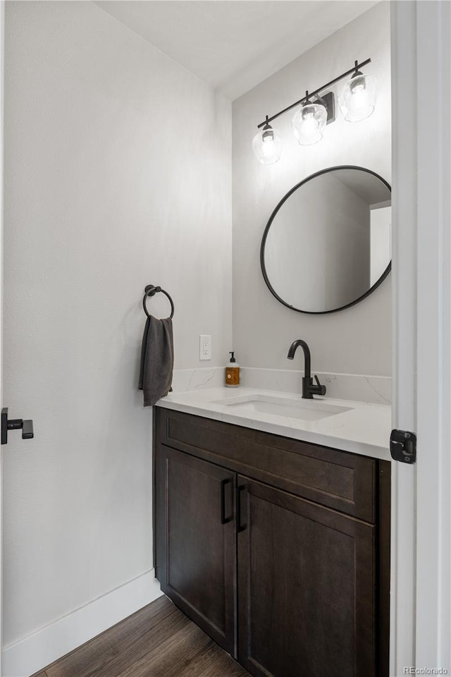 4184 Kalamath St, Denver, CO 80211 - bathroom featuring vanity, wood finished floors, and baseboards