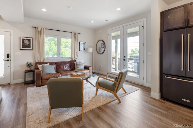 4184 Kalamath St, Denver, CO 80211 - living area featuring light wood-type flooring, baseboards, recessed lighting, and french doors