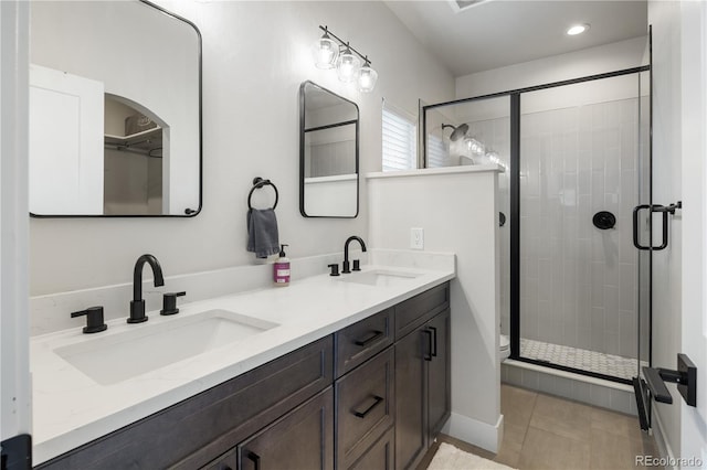 4184 Kalamath St, Denver, CO 80211 - full bath with a shower stall, double vanity, tile patterned flooring, recessed lighting, and toilet