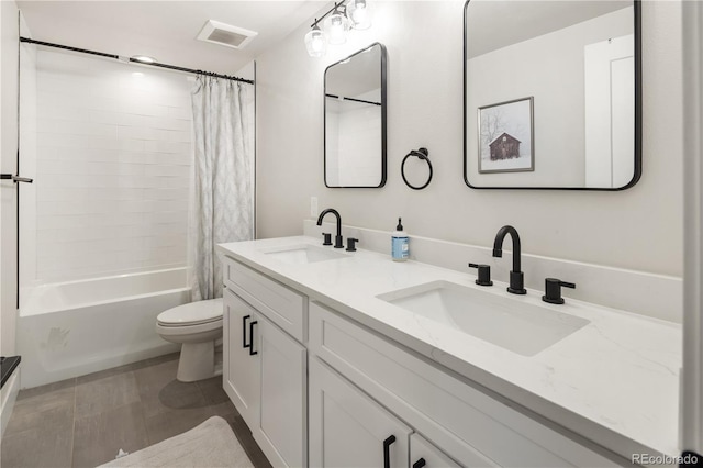 4184 Kalamath St, Denver, CO 80211 - bathroom with double vanity, toilet, and shower / bathtub combination with curtain