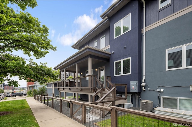 4184 Kalamath St, Denver, CO 80211 - back of property with cooling unit, stairs, and stucco siding