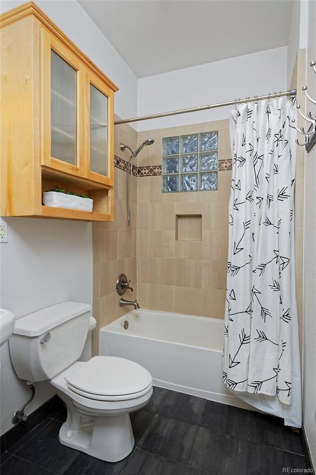 2527 W Dunkeld Pl, Denver, CO 80211 - bathroom featuring toilet and shower / tub combo with curtain
