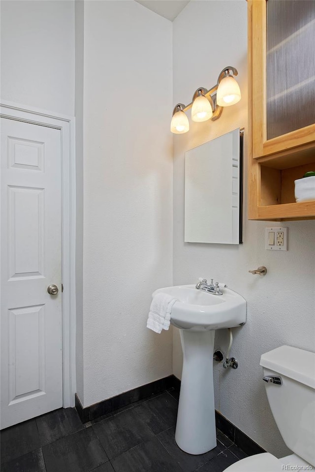 2527 W Dunkeld Pl, Denver, CO 80211 - half bath with toilet and baseboards