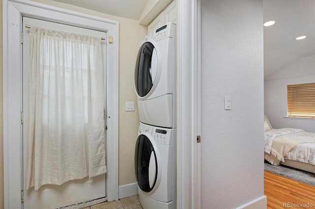 2527 W Dunkeld Pl, Denver, CO 80211 - laundry area featuring estacked washer and dryer, recessed lighting, and plenty of natural light