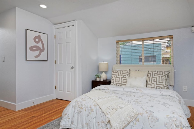 2527 W Dunkeld Pl, Denver, CO 80211 - bedroom with wood finished floors, lofted ceiling, and recessed lighting