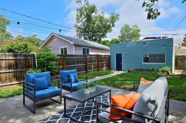 2527 W Dunkeld Pl, Denver, CO 80211 - fenced backyard with outdoor lounge area and a patio area