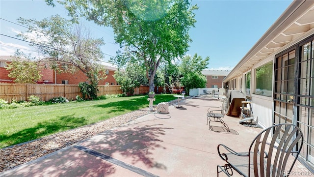 4940 E Donald Ave Unit 8, Denver, CO 80222 - fenced backyard with a patio area
