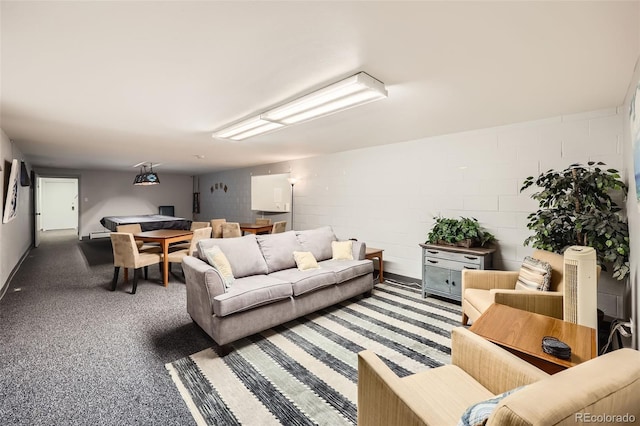 4940 E Donald Ave Unit 8, Denver, CO 80222 - carpeted living room featuring concrete block wall