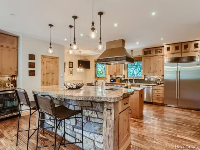 3135 11th St, Boulder, CO 80304 - kitchen featuring stainless steel appliances, a large island with sink, island range hood, backsplash, and recessed lighting