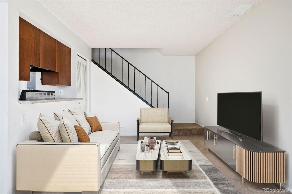 living room featuring a textured ceiling