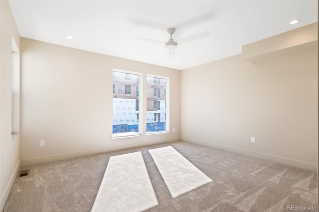 carpeted empty room with ceiling fan