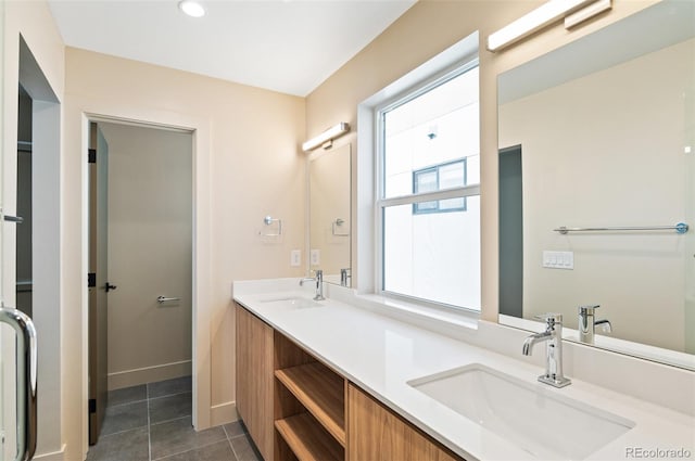 bathroom with tile patterned floors and vanity