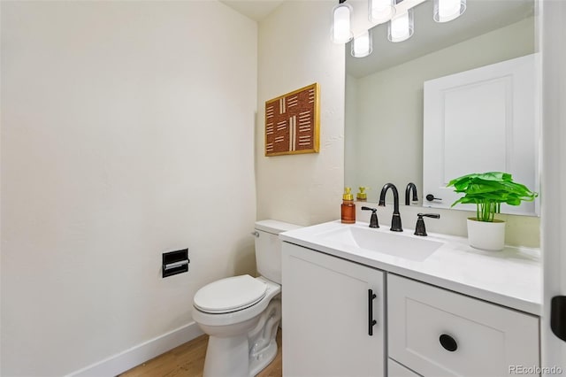 3533 Saguaro Cir, Colorado Springs, CO 80925 - half bath with vanity and wood finished floors