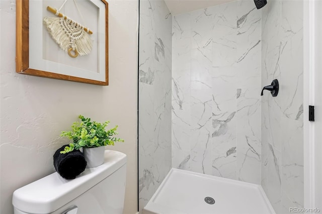 3533 Saguaro Cir, Colorado Springs, CO 80925 - full bathroom featuring toilet and a marble finish shower