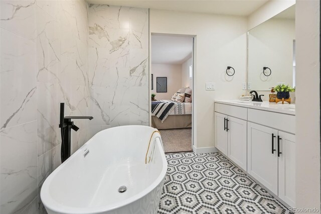 3533 Saguaro Cir, Colorado Springs, CO 80925 - bathroom featuring connected bathroom, vanity, and a freestanding tub