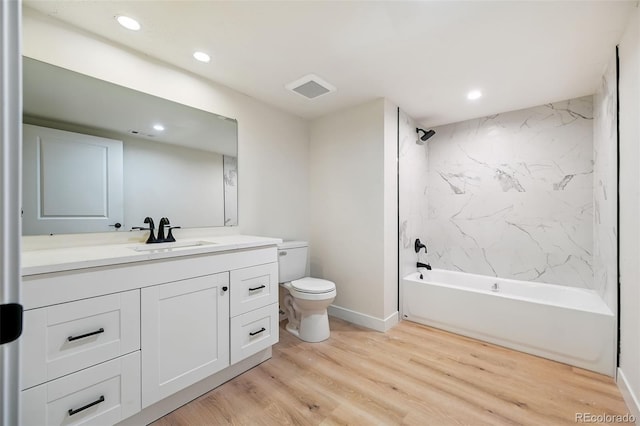 3533 Saguaro Cir, Colorado Springs, CO 80925 - full bath with vanity,  shower combination, recessed lighting, and wood finished floors