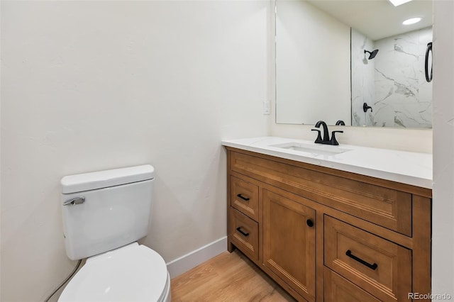 3533 Saguaro Cir, Colorado Springs, CO 80925 - full bath with vanity, wood finished floors, and a marble finish shower