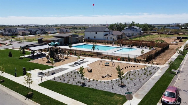 birds eye view of property with a residential view