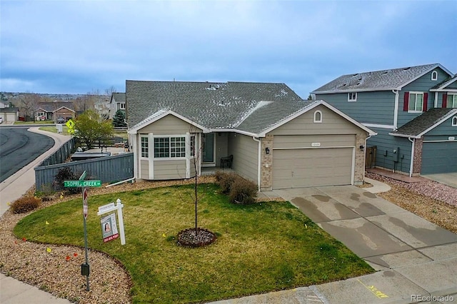 view of front of house with an attached garage, concrete driveway, and a residential view