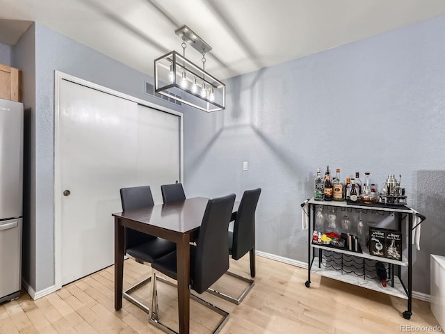 dining room with light hardwood / wood-style flooring