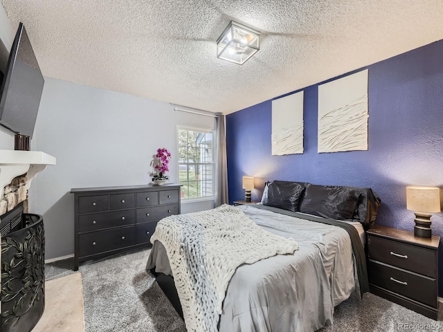 carpeted bedroom featuring a textured ceiling