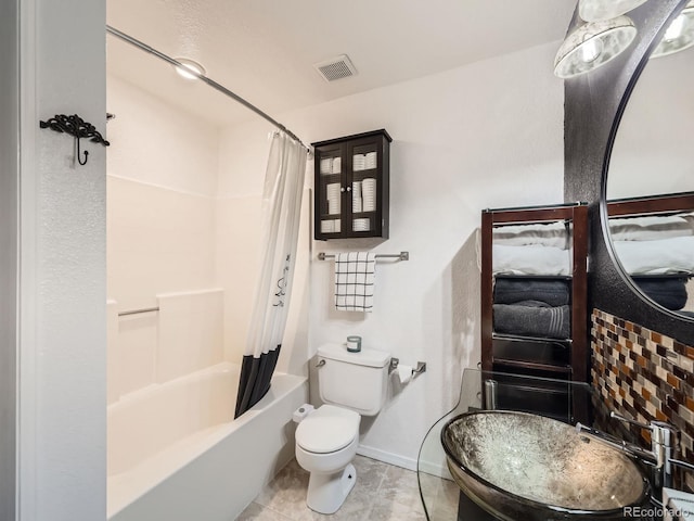 full bathroom with sink, tile patterned flooring, shower / bath combination with curtain, and toilet