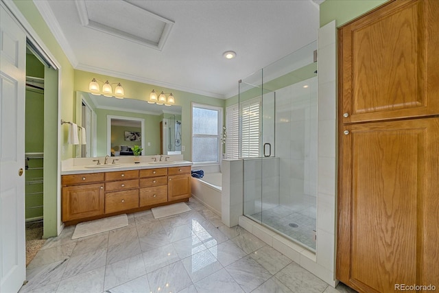 bathroom featuring vanity, ornamental molding, and independent shower and bath