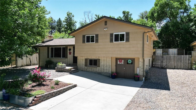 tri-level home with a patio area