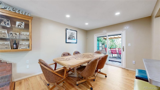 dining space featuring light wood-type flooring