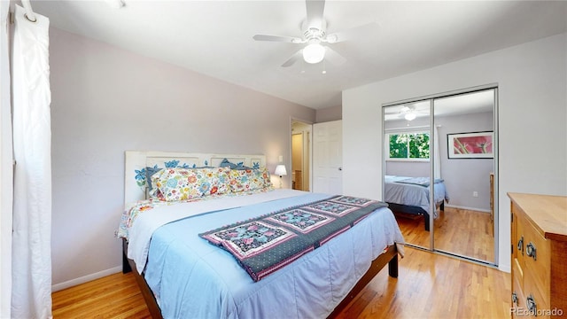 bedroom with ceiling fan, a closet, and light wood-type flooring