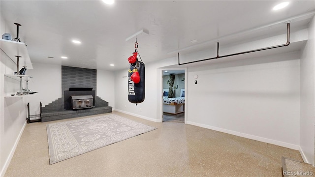 unfurnished living room with a wood stove