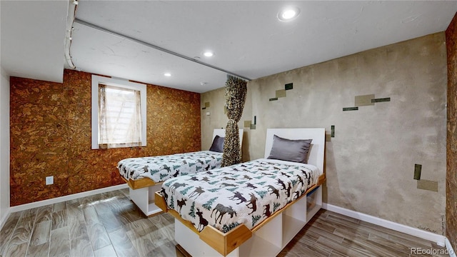 bedroom with hardwood / wood-style flooring