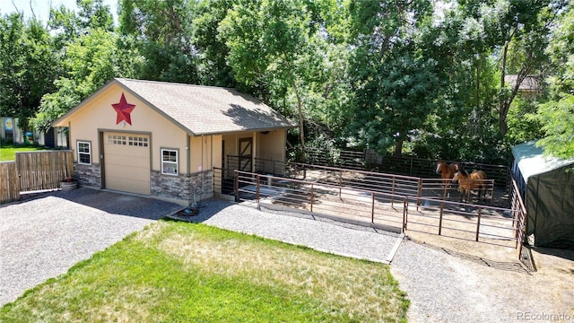 view of front of property featuring an outbuilding