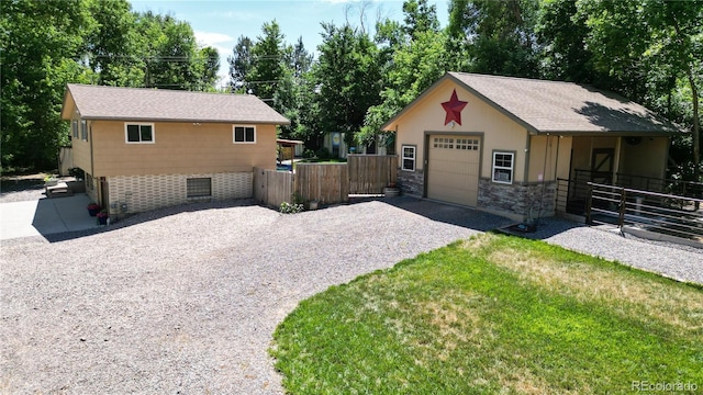 exterior space featuring a garage and an outdoor structure